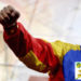 Venezuelan President Nicolas Maduro raises his fist during a May Day rally in Caracas on May 1, 2014. AFP PHOTO/FEDERICO PARRA (Photo credit should read FEDERICO PARRA/AFP/Getty Images)