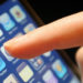 The logo of social networking website Twitter is seen displayed on the screen of an iPhone smartphone.