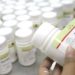 epa000321318 An Indonesian employee of Kimia Farma pharmacy company puts the 'Neviral's' logo onto bottles in Bandung, West Java Indonesia on 30 November 2004. 'Nerival' is a medicine for HIV patients. Kimia Farma pharmacy produce more than 4,8 millions 'Nerival' pills per year and distribute them to many hospitals for treat more than 100,000 HIV/ AIDS patients in Indonesia. The Joint United Nations Program on HIV/ AIDS (UNAIDS) warned Indonesia on Tuesday that the virus was spreading rapidly among women and girls in the country. The number of people living with HIV/ AIDS in the country is between 90,000 and 135,000, according to UNAIDS. EPA/BAGUS INDAHONO