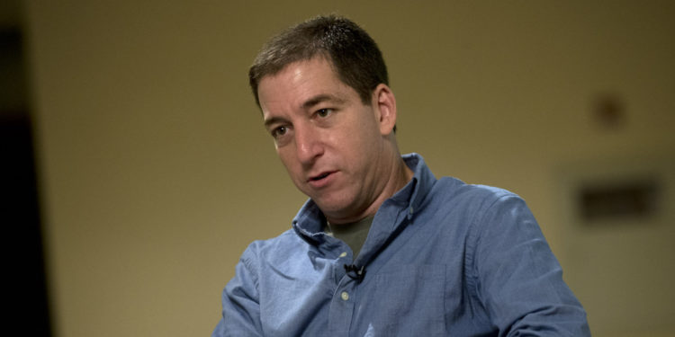 Journalist Glenn Greenwald speaks during an interview with the Associated Press in Rio de Janeiro, Brazil, Sunday, July 14, 2013.  Greenwald, The Guardian journalist who first reported Edward Snowden's disclosures of U.S. surveillance programs says the former National Security Agency analyst has "very specific blueprints of how the NSA do what they do."(AP Photo/Silvia Izquierdo)