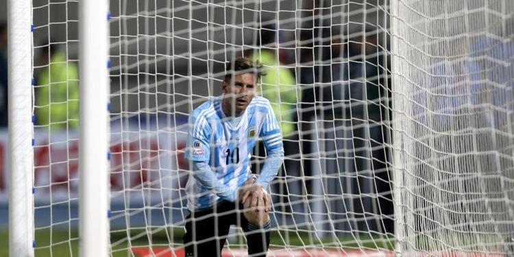Argentina's Lionel Messi picks himself up after missing a chance to score against Chile during the Copa America final soccer match at the National Stadium in Santiago, Chile, Saturday, July 4, 2015. (AP Photo/Luis Hidalgo)