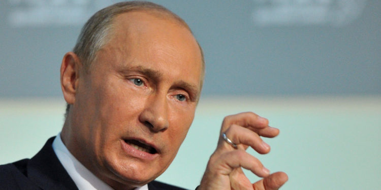 Russian President Vladimir Putin delivers his speech on the eve of the Asia-Pacific Economic Cooperation (APEC) summit in Vladivostok on September 7, 2012. APEC leaders' summit in Russia's far eastern port city of Vladivostok will take place on September 8 and 9. AFP PHOTO / POOL / ALEXANDER NEMENOVYURI KADOBNOV/AFP/GettyImages