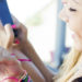 three girls chatting with their smartphones