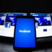 The loading screen of the Facebook application on a mobile phone is seen in this photo illustration taken in Lavigny May 16, 2012. Facebook Inc increased the size of its initial public offering by almost 25 percent, and could raise as much as $16 billion as strong investor demand for a share of the No.1 social network trumps debate about its long-term potential to make money. Facebook, founded eight years ago by Mark Zuckerberg in a Harvard dorm room, said on Wednesday it will add about 84 million shares to its IPO, floating about 421 million shares in an offering expected to be priced on Thursday. REUTERS/Valentin Flauraud (SWITZERLAND - Tags: BUSINESS SCIENCE TECHNOLOGY SOCIETY TPX IMAGES OF THE DAY) - RTR325LC