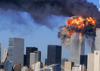 SEVENTH IN A PACKAGE OF NINE PHOTOS.–– An explosion rips through the South Tower of the World Trade Towers after the hijacked United Airlines Flight 175, which departed from Boston en route for Los Angeles, crashed into it Sept, 11, 2001. The North Tower is shown burning after American Airlines Flight 11 crashed into the tower at 8:45 a.m. (AP Photo/Aurora, Robert Clark)