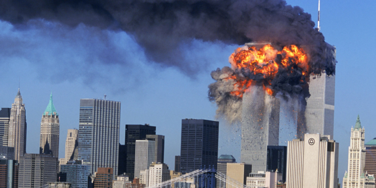 SEVENTH IN A PACKAGE OF NINE PHOTOS.–– An explosion rips through the South Tower of the World Trade Towers after the hijacked United Airlines Flight 175, which departed from Boston en route for Los Angeles, crashed into it Sept, 11, 2001. The North Tower is shown burning after American Airlines Flight 11 crashed into the tower at 8:45 a.m. (AP Photo/Aurora, Robert Clark)