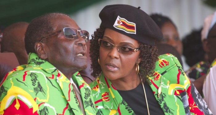 Zimbabwean President Robert Mugabe and his wife Grace follow proceedings during a youth rally in Marondera about 100 kilometres east of Harare, Friday, June, 2, 2017.The rally was held as part of his 2017 Presidential election campaign bid where the youth declared Mugabe as the sole candidate and life President of the Southern African nation.(AP Photo/Tsvangirayi Mukwazhi)