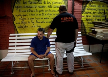 Marcelo Pinheiro, aka Marcelo Piloto, a drug dealer and alleged weapons supplier for Rio de Janeiro's criminal gang the Red Command (CV), is presented to the media after being arrested in Itapua region, in Asuncion, Paraguay December 14, 2017. REUTERS/Jorge Adorno