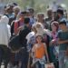 epa04910635 Refugees waiting to cross the border between Macedonia and Greece, near the town of Gevgelija, The Former Yugoslav Republic of Macedonia, 03 September 2015. The Gevgelija-Presevo journey is just a part of the journey that the refugees, the vast majority of them from Syria, are forced to make along the so-called Balkan corridor, which takes them from Turkey, across Greece, Macedonia and Serbia to Hungary, the gateway to the European Union. EPA/VALDRIN XHEMAJ