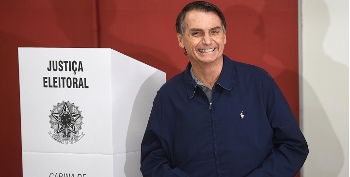 Brazil's right-wing presidential candidate for the Social Liberal Party (PSL) Jair Bolsonaro smiles after casting his vote during general elections, in Rio de Janeiro, Brazil, on October 7, 2018.
Polling stations opened in Brazil on Sunday for the most divisive presidential election in the country in years, with far-right lawmaker Jair Bolsonaro the clear favorite in the first round. About 147 million voters are eligible to cast ballots and choose who will rule the world's eighth biggest economy. New federal and state legislatures will also be elected. / AFP PHOTO / Mauro Pimentel