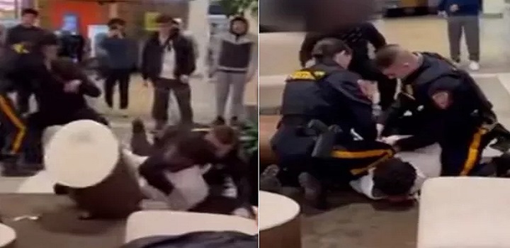 Policial acalma jovem branco enquanto outro algema negro em briga no shopping
