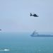 Helicópteros militares chineses sobrevoam a ilha de Pingtan, um dos po