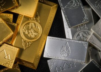Ouro e prata caem com alta do petróleo e juros elevados nos EUA.